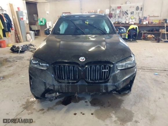 2023 BMW X4 M with VIN 5YM23EC05P9R57259, listed as a IAAI auction lot 41003784 with 33,928 mi miles. Bid and sale history available at carsss.com. Image 6.