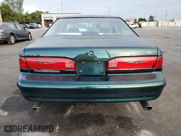 1994 Ford Thunderbird LX with VIN 1FALP62W6RH128762, listed as a Copart auction lot 84306604 with 68,314 mi miles and Salvage Title. Bid and sale history available at DreamBid. Image 6.