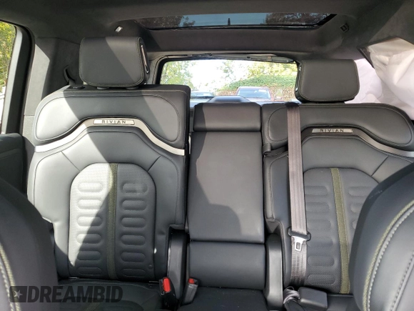 2024 Rivian R1S Adventure z VIN 7PDSGABAXRN035766, wystawiony jako Copart lot #77481034 z przebiegiem 6 590 mil mil oraz Szkoda całkowita • Salvage title. Historia ofert i sprzedaży dostępna na DreamBid. Obrazek 10.