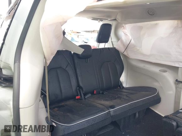 2023 Chrysler Pacifica Limited with VIN 2C4RC1GG4PR619997, listed as a IAAI auction lot 42421682 with 51,520 mi miles and . Bid and sale history available at DreamBid. Image 14.
