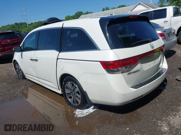 2014 Honda Odyssey Touring with VIN 5FNRL5H94EB071788, listed as a IAAI auction lot 42523959 with 244,734 mi miles and . Bid and sale history available at DreamBid. Image 3.