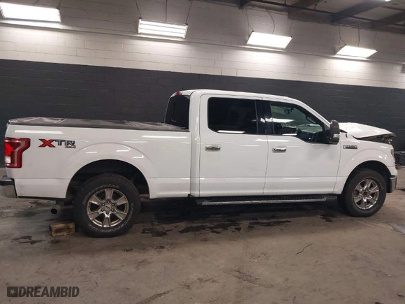 2015 Ford F-150 XLT w/HD Payload Pkg with VIN 1FTFW1EF8FKF09732, listed as a IAAI auction lot 41064468 with 105,340 mi miles. Bid and sale history available at carsss.com. Image 13.