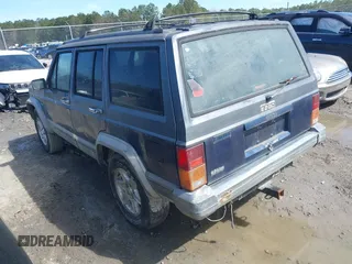 1996 Jeep Cherokee Country with VIN 1J4FT78S5TL148433, listed as a IAAI auction lot 41722054 with 276,612 mi miles and . Bid and sale history available at DreamBid. Image 3.