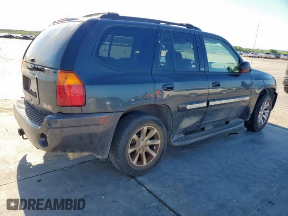 2003 GMC Envoy SLT z VIN 1GKDS13S332281271, wystawiony jako Copart lot #53685775 z przebiegiem 236 997 mil mil oraz Szkody całkowita. Historia ofert i sprzedaży dostępna na DreamBid. Obrazek 3.
