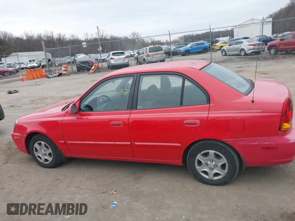 2005 Hyundai Accent GLS with VIN KMHCG45CX5U614083, listed as a IAAI auction lot 41006582 with 72,516 mi miles. Bid and sale history available at carsss.com. Image 14.