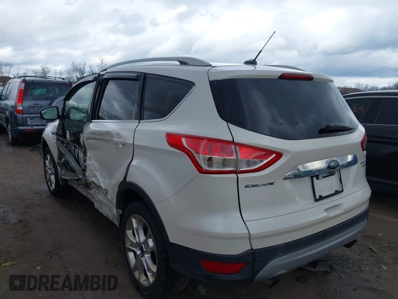 2016 Ford Escape Titanium with VIN 1FMCU9JX9GUA62674, listed as a IAAI auction lot 41838996 with 135,105 mi miles. Bid and sale history available at carsss.com. Image 3.