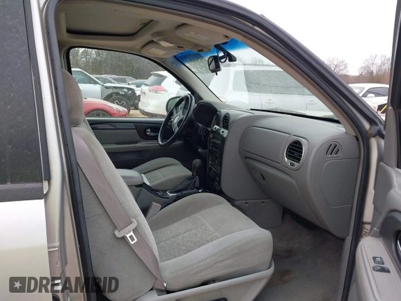 2005 GMC Envoy SLT with VIN 1GKDT13S452263166, listed as a IAAI auction lot 41543466 with 166,999 mi miles. Bid and sale history available at carsss.com. Image 5.