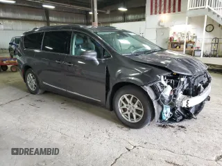 2021 Chrysler Pacifica Touring L with VIN 2C4RC1BGXMR588001, listed as a Copart auction lot 54562505 with 128,350 mi miles and Salvage title. Bid and sale history available at DreamBid. Image 4.