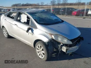 2013 Ford Fiesta SE with VIN 3FADP4BJ1DM109411, listed as a IAAI auction lot 41040984 with 163,219 mi miles. Bid and sale history available at carsss.com. Image 1.