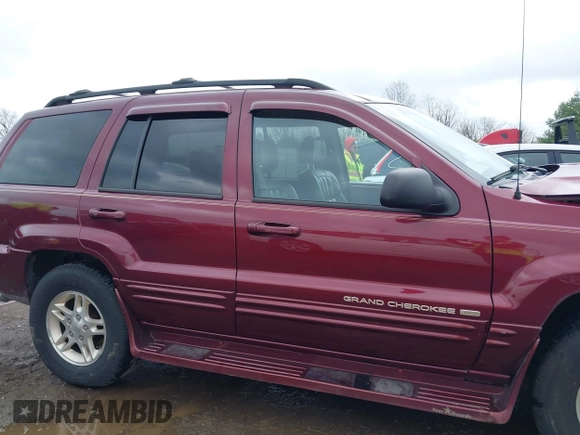 1999 Jeep Grand Cherokee Limited with VIN 1J4GW68N5XC642670, listed as a IAAI auction lot 41990199 with 154,492 mi miles. Bid and sale history available at carsss.com. Image 14.