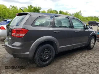 2014 Dodge Journey American Value with VIN 3C4PDCAB1ET135504, listed as a Copart auction lot 58803645 with 164,501 mi miles and Clean title. Bid and sale history available at DreamBid. Image 3.