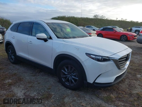 2021 Mazda CX-9 Touring with VIN JM3TCACY3M0505376, listed as a IAAI auction lot 40524326 with 1 mi miles. Bid and sale history available at carsss.com. Image 1.