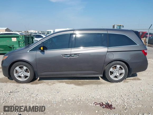 2013 Honda Odyssey Touring with VIN 5FNRL5H98DB080296, listed as a IAAI auction lot 42461843 with 104,901 mi miles and . Bid and sale history available at DreamBid. Image 14.