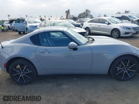 2024 Mazda MX-5 Miata Grand Touring z VIN JM1NDAM76R0602860, wystawiony jako IAAI lot #41346197 z przebiegiem 1 891 mil mil oraz . Historia ofert i sprzedaży dostępna na DreamBid. Obrazek 13.