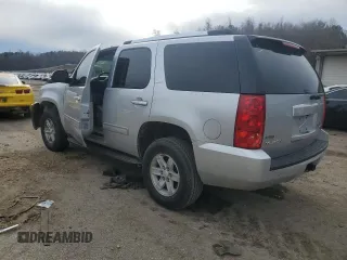 2012 GMC Yukon SLT with VIN 1GKS1CE08CR203822, listed as a Copart auction lot 82955253 with 122,508 mi miles and Salvage Title. Bid and sale history available at carsss.com. Image 2.