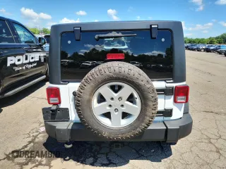 2015 Jeep Wrangler Unlimited Freedom with VIN 1C4HJWDGXFL755528, listed as a Copart auction lot 64927525 with 111,096 mi miles and Salvage title. Bid and sale history available at DreamBid. Image 6.