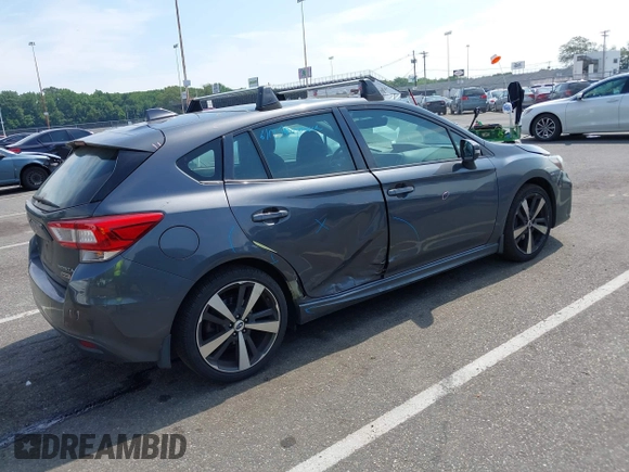 2018 Subaru Impreza Special Sports with VIN 4S3GTAM62J3702931, listed as a IAAI auction lot 42615234 with 111,272 mi miles and . Bid and sale history available at DreamBid. Image 4.