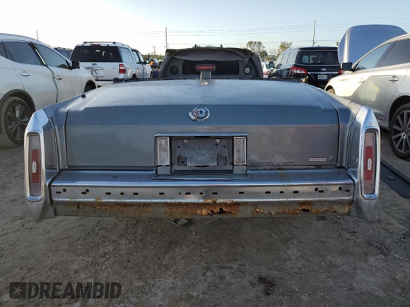 1990 Cadillac Brougham z VIN 1G6DW5472LR711206, wystawiony jako Copart lot #75627814 z przebiegiem Nie podano mil oraz Nie do naprawy. Historia ofert i sprzedaży dostępna na DreamBid. Obrazek 6.