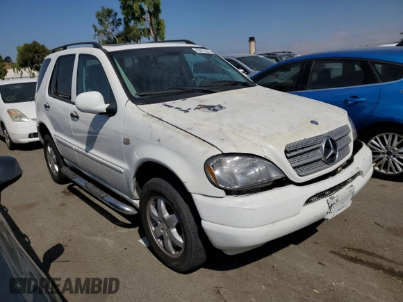 2000 Mercedes-Benz M-Class with VIN 4JGAB54E5YA165660, listed as a Copart auction lot 65872364 with 115,668 mi miles and Salvage Title. Bid and sale history available at carsss.com. Image 4.