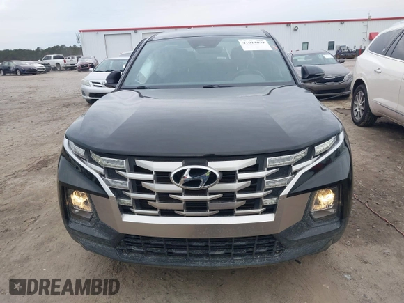 2022 Hyundai Santa Cruz SEL z VIN 5NTJBDAE5NH008011, wystawiony jako IAAI lot #41614699 z przebiegiem 57 484 mil mil oraz . Historia ofert i sprzedaży dostępna na DreamBid. Obrazek 12.
