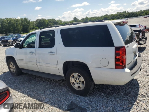 2013 Chevrolet Suburban LT with VIN 1GNSCJE0XDR146798, listed as a Copart auction lot 62408525 with 218,484 mi miles and Salvage title. Bid and sale history available at DreamBid. Image 2.