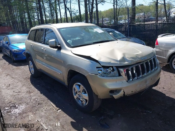 2011 Jeep Grand Cherokee Laredo with VIN 1J4RR4GG8BC590094, listed as a IAAI auction lot 41990149 with 178,510 mi miles. Bid and sale history available at carsss.com. Image 1.