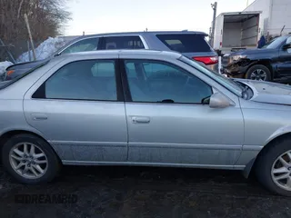 2001 Toyota Camry LE z VIN 4T1BF28K11U122669, wystawiony jako IAAI lot #41574866 z przebiegiem 233 301 mil mil oraz . Historia ofert i sprzedaży dostępna na DreamBid. Obrazek 13.