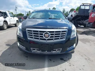 2014 Cadillac XTS Luxury z VIN 2G61N5S30E9170305, wystawiony jako IAAI lot #42223317 z przebiegiem 103 692 mil mil oraz . Historia ofert i sprzedaży dostępna na DreamBid. Obrazek 12.