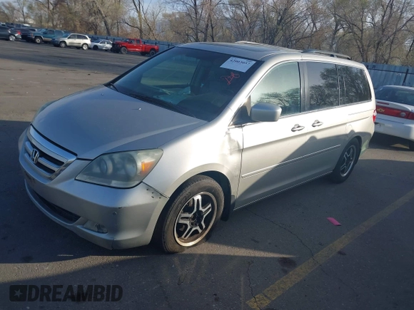 2005 Honda Odyssey TOURING with VIN 5FNRL38875B004209, listed as a IAAI auction lot 42003057 with 242,794 mi miles. Bid and sale history available at carsss.com. Image 2.
