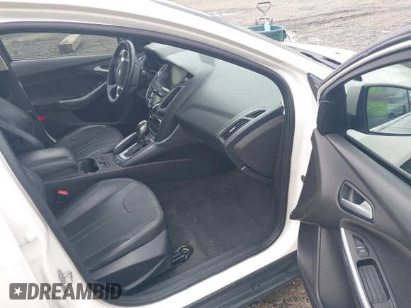 2014 Ford Focus Titanium with VIN 1FADP3J27EL142095, listed as a IAAI auction lot 42004419 with 139,515 mi miles. Bid and sale history available at carsss.com. Image 5.