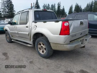 2003 Ford Explorer Sport Trac XLS z VIN 1FMZU77E93UA38468, wystawiony jako IAAI lot #41667956 z przebiegiem 291 806 mil mil oraz . Historia ofert i sprzedaży dostępna na DreamBid. Obrazek 3.