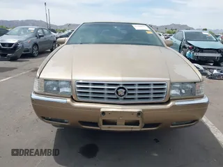 1999 Cadillac Eldorado ESC z VIN 1G6EL12Y5XU603764, wystawiony jako IAAI lot #42368692 z przebiegiem 154 613 mil mil oraz . Historia ofert i sprzedaży dostępna na DreamBid. Obrazek 6.