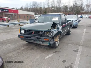 1992 Mitsubishi Mighty Max z VIN JA7FL24W5NP011633, wystawiony jako IAAI lot #41864873 z przebiegiem 301 895 mil mil oraz . Historia ofert i sprzedaży dostępna na DreamBid. Obrazek 17.