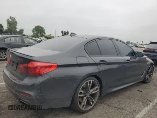 2019 BMW 5 Series M550i xDrive with VIN WBAJB9C59KB287501, listed as a Copart auction lot 59732425 with 74,345 mi miles and Salvage title. Bid and sale history available at DreamBid. Image 3.