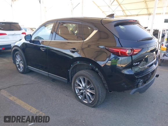 2020 Mazda CX-5 Grand Touring z VIN JM3KFADMXL0740144, wystawiony jako IAAI lot #41830203 z przebiegiem 70 535 mil mil oraz . Historia ofert i sprzedaży dostępna na DreamBid. Obrazek 3.