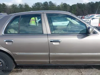 2005 Mercury Grand Marquis GS with VIN 2MEFM74W55X603152, listed as a IAAI auction lot 41872534 with 84,290 mi miles. Bid and sale history available at carsss.com. Image 13.