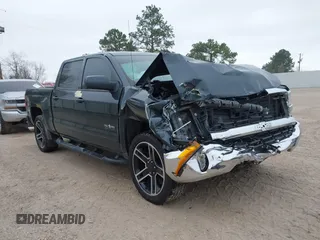 2018 Chevrolet Silverado 1500 LT with VIN 3GCPCREC1JG497019, listed as a IAAI auction lot 41459936 with 52,691 mi miles and . Bid and sale history available at DreamBid. Image 1.