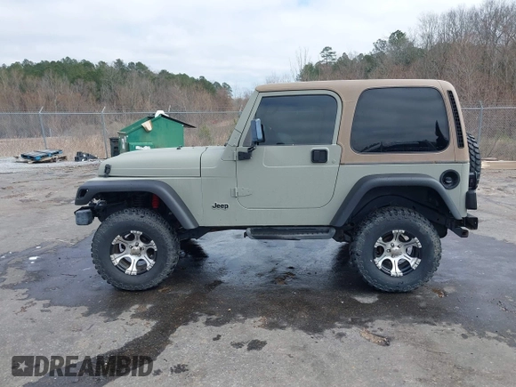 1999 Jeep Wrangler Sahara with VIN 1J4FY49S0XP480017, listed as a IAAI auction lot 41642577 with 154,068 mi miles. Bid and sale history available at carsss.com. Image 14.