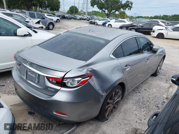 2014 Mazda 6 i Grand Touring с VIN JM1GJ1W6XE1159641, выставлен на аукционе IAAI как лот 39305628 с пробегом 107 853 миль миль и . История ставок и продаж доступна на DreamBid. Изображение 4.