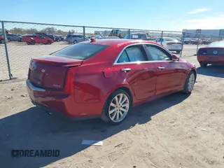 2014 Cadillac ATS Luxury AWD with VIN 1G6AH5RX0E0176647, listed as a IAAI auction lot 40939517 with 103,348 mi miles and . Bid and sale history available at DreamBid. Image 4.