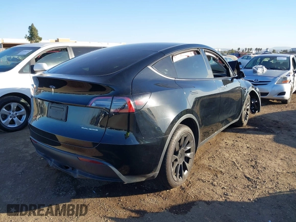 2023 Tesla Model Y Long Range with VIN 7SAYGDEE0PF907260, listed as a IAAI auction lot 41180227 with Not Provided miles and . Bid and sale history available at DreamBid. Image 4.