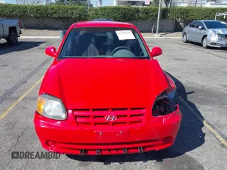 2003 Hyundai Accent GL with VIN KMHCG45C93U487209, listed as a IAAI auction lot 41590636 with 118,811 mi miles. Bid and sale history available at carsss.com. Image 12.