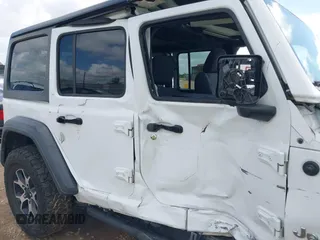 2018 Jeep Wrangler Unlimited Sport S z VIN 1C4HJXDG4JW298647, wystawiony jako IAAI lot #41930817 z przebiegiem 64 761 mil mil oraz . Historia ofert i sprzedaży dostępna na DreamBid. Obrazek 6.