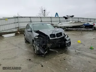 2012 BMW X5 M with VIN 5YMGY0C54CLK27815, listed as a Copart auction lot 83010304 with 0 mi miles and Salvage Title. Bid and sale history available at carsss.com. Image 11.
