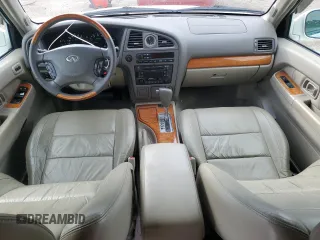 2003 Infiniti QX4 with VIN JNRDR09X83W251941, listed as a Copart auction lot 71044774 with 162,214 mi miles and Salvage Title. Bid and sale history available at DreamBid. Image 8.