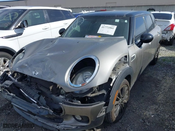 2016 MINI Cooper Clubman with VIN WMWLN5C56G2E30309, listed as a IAAI auction lot 41772501 with 67,584 mi miles. Bid and sale history available at carsss.com. Image 2.