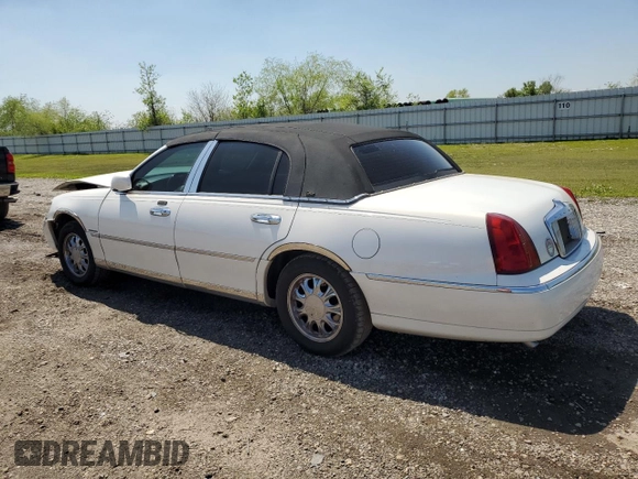 2001 Lincoln Town Car Cartier z VIN 1LNHM83W91Y728971, wystawiony jako Copart lot #50643965 z przebiegiem Nie podano mil oraz Szkoda całkowita • Salvage title. Historia ofert i sprzedaży dostępna na DreamBid. Obrazek 2.
