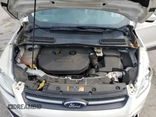 2016 Ford Escape SE z VIN 1FMCU9G97GUB45352, wystawiony jako Copart lot #60001055 z przebiegiem 93 685 mil mil oraz Szkoda całkowita • Salvage title. Historia ofert i sprzedaży dostępna na DreamBid. Obrazek 12.