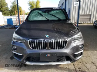 2017 BMW X1 sDrive28i with VIN WBXHU7C34HP924730, listed as a Copart auction lot 52245005 with 0 mi miles and Salvage Title. Bid and sale history available at carsss.com. Image 5.