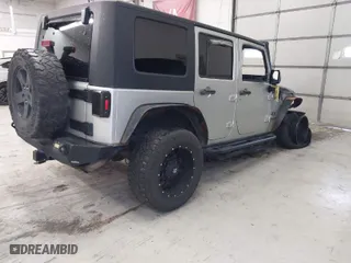 2009 Jeep Wrangler Unlimited X with VIN 1J4GA39159L763484, listed as a IAAI auction lot 40761006 with 1 mi miles. Bid and sale history available at carsss.com. Image 4.